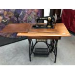 A sewing machine table and sewing machine