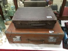 2 old suitcases