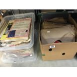A box of 78 rpm records with a box of sheet music
