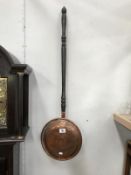 A Victorian copper bed warming pan