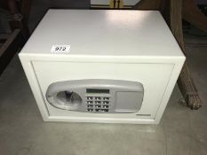 A small metal safe with number combinations (see office for number)