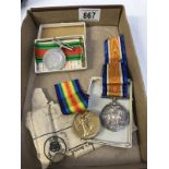 A quantity of WWI medals belonging to 100980 PTE E J Fuller MGC & WWII Defence medal in box to E-J