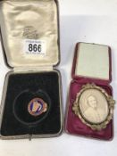 A Victorian revolving mourning brooch with picture,