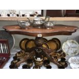 A dark wood stained decorative coffee table