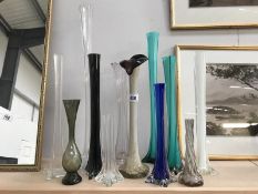 A quantity of tall vases