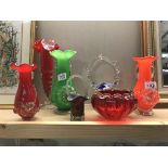 A quantity of pretty coloured glass vases etc.