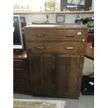 A 2 drawer oak cabinet