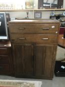 A 2 drawer oak cabinet