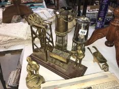 2 miner's lamps (Hailwood & Ackroyd and Protector Lamp & Lighting Co ltd) and a brass and wood