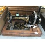 A vintage Frister Rossman sewing machine in inlaid case