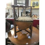 An unusual Victorian oak corner chair commode