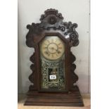An American gingerbread mantle clock ****Condition report**** Fully wound, strikes,