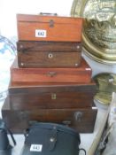 A quantity of vintage wooden boxes including a writing box