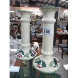A pair of Poole Pottery candlesticks