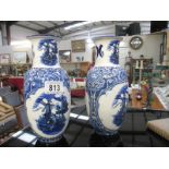 A pair of blue and white Delft vases