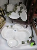 A collection of strawberry plates and dish