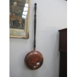 A copper warming pan