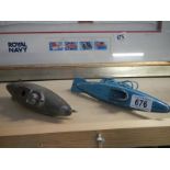 2 tinplate submarines