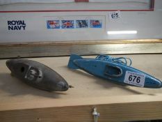 2 tinplate submarines