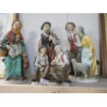 3 Royal Meridian Noritake figures of elderly people and one other similar group figure,