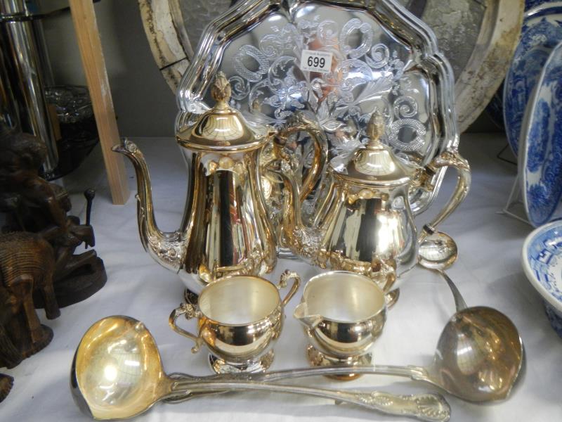 A quantity of silver plate including ladles, tea set etc.