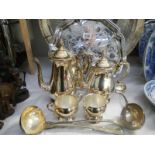 A quantity of silver plate including ladles, tea set etc.