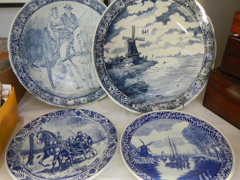 2 Delft blue and white chargers and 2 Delft plates