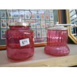 2 x 20th century cranberry biscuit barrels with silver plate tops