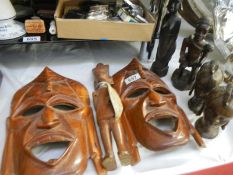 A quantity of African head carvings etc.
