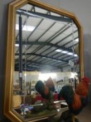 A gilt framed mirror