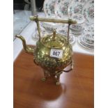 An ornate brass tea kettle on stand A/F