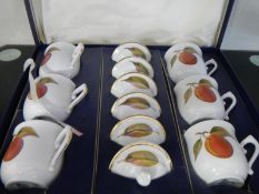 A Royal Worcester boxed set of coffee cups/cans with lids