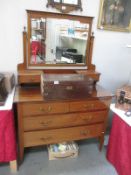 A mirror backed dresser with drawers