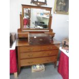 A mirror backed dresser with drawers