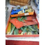 A tray of early Meccano pieces etc.