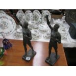 2 spelter male figures with right hand aloft as if carrying items (carried items missing)