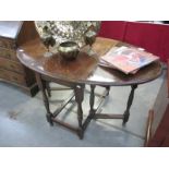 An oval drop leaf table