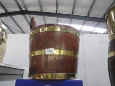 An old water bucket with brass surrounds