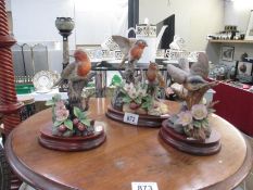 3 Kowa Porcelain bird figurines on wooden stands