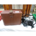 A Pentax Asahi camera and lens and case