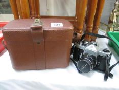 A Pentax Asahi camera and lens and case