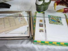 A collection of world stamps on sheets and in packets