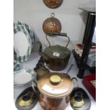 A quantity of brass and copper including a kettle and jelly moulds