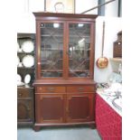 A glazed bureau bookcase