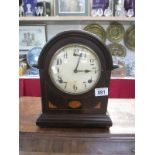 A wooden mantel clock