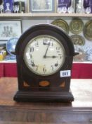 A wooden mantel clock