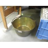 A heavy brass jam pan