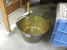 A heavy brass jam pan