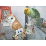 A Beswick owl and a Beswick parrot