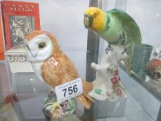 A Beswick owl and a Beswick parrot